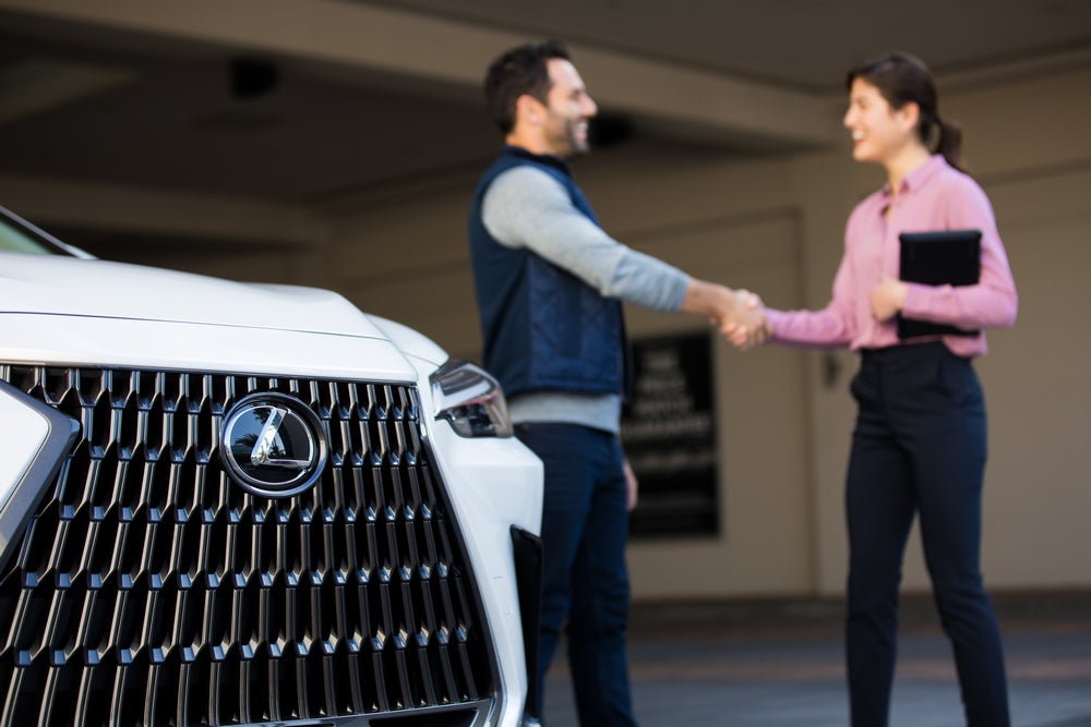 Salesperson and customer shaking hands